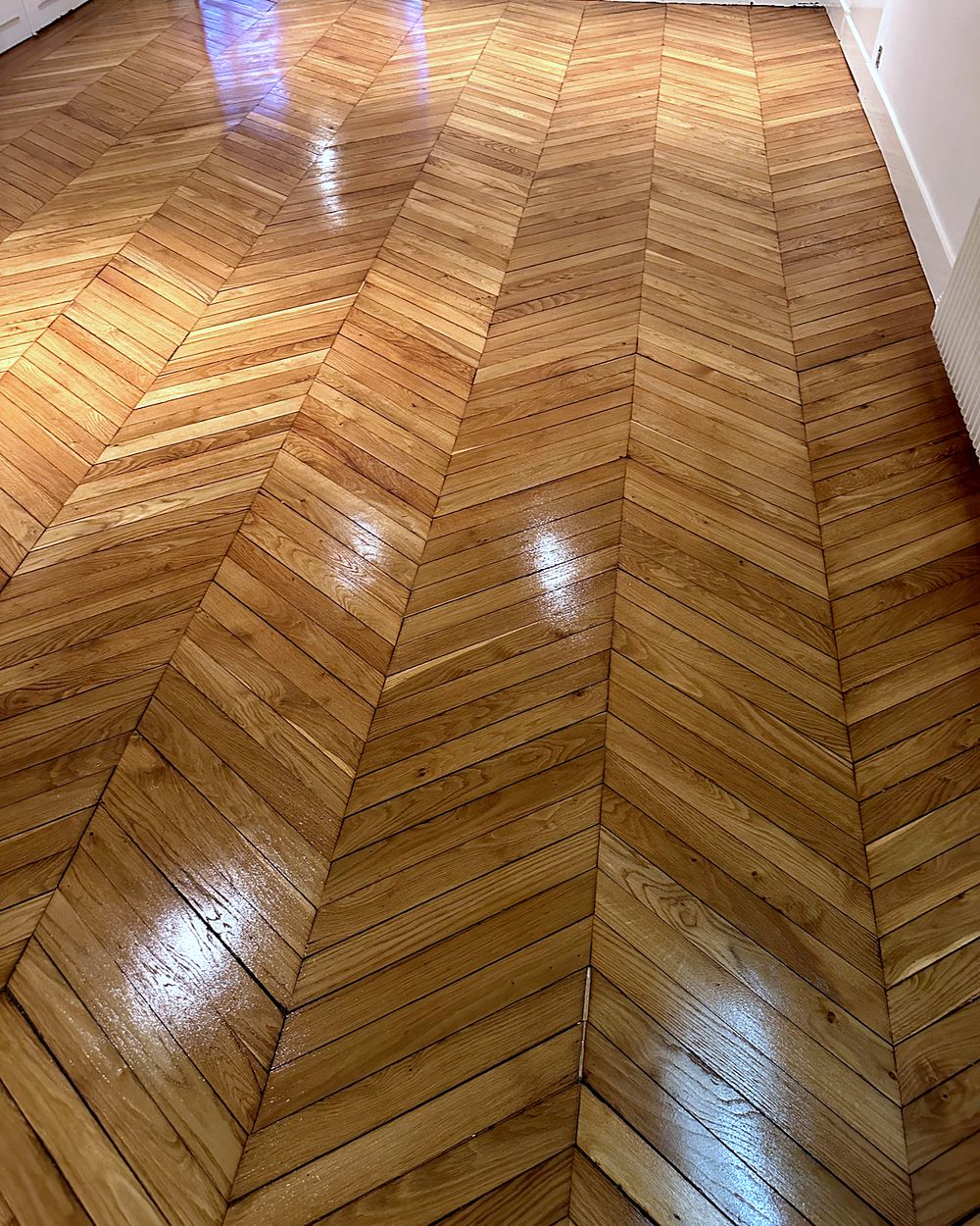 Parquet à chevrons après rénovation – Maxard Parquet